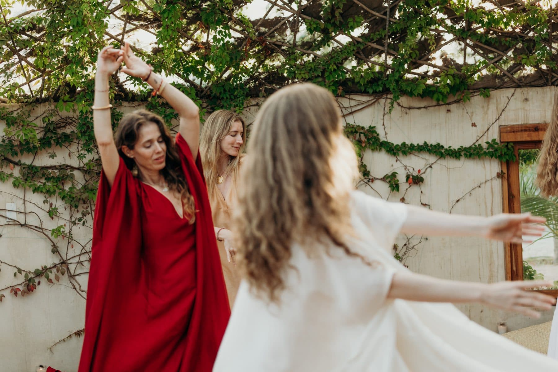 Women dancing together at a Casa Damara gathering